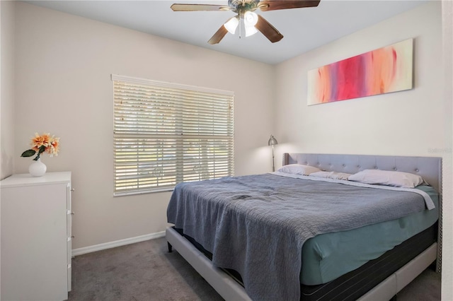 carpeted bedroom featuring a ceiling fan and baseboards