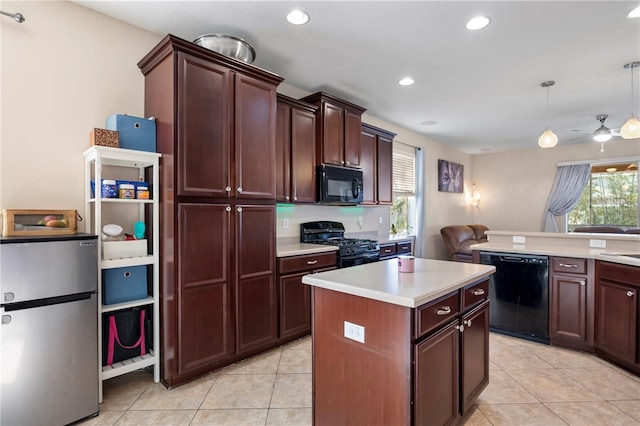 kitchen with black appliances, light tile patterned floors, light countertops, and a wealth of natural light