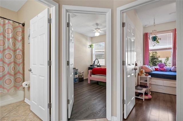 interior space featuring baseboards and wood finished floors