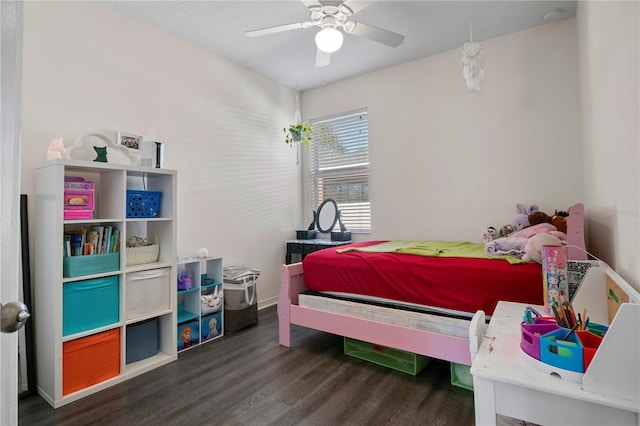 bedroom with dark wood-style floors and a ceiling fan