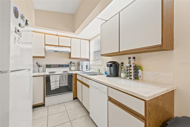 kitchen featuring light countertops, white cabinets, a sink, white appliances, and under cabinet range hood