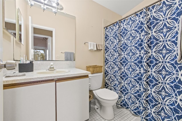 bathroom featuring vanity, a shower with shower curtain, tile patterned flooring, and toilet