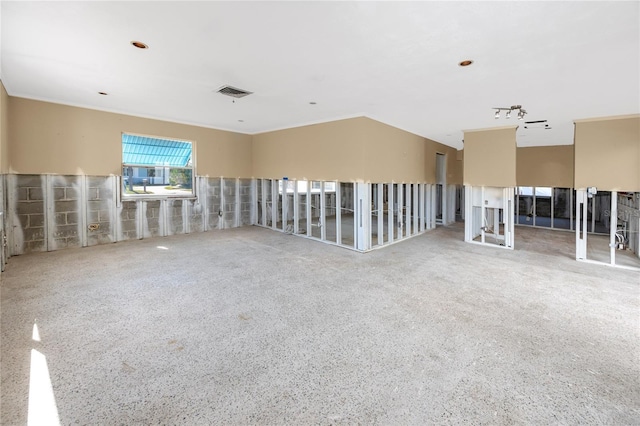 spare room with visible vents and speckled floor