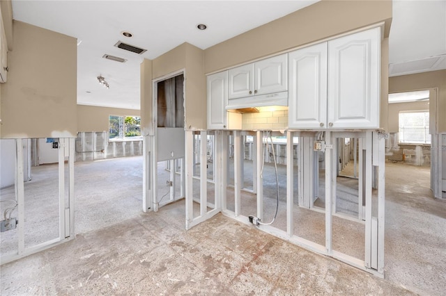 empty room featuring plenty of natural light and visible vents