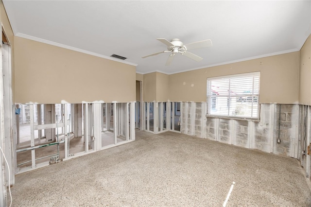 spare room featuring visible vents, crown molding, and ceiling fan