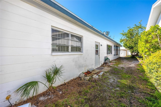 view of property exterior featuring fence