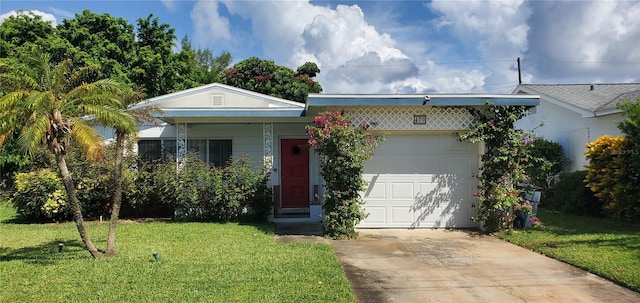 479 80th Way, St Pete Beach, FL 33706 - view of front of property with concrete driveway, a front yard, and an attached garage
