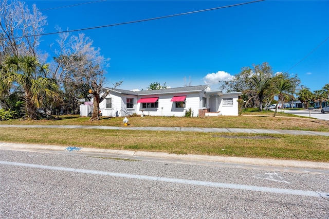 479 80th Way, St Pete Beach, FL 33706 - ranch-style home with a front yard