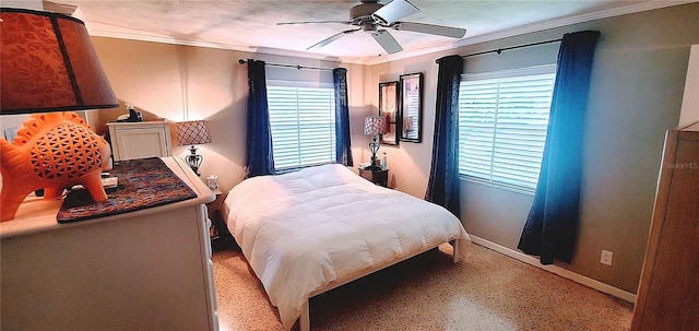 479 80th Way, St Pete Beach, FL 33706 - bedroom with ornamental molding, multiple windows, dark speckled floor, baseboards, and a ceiling fan