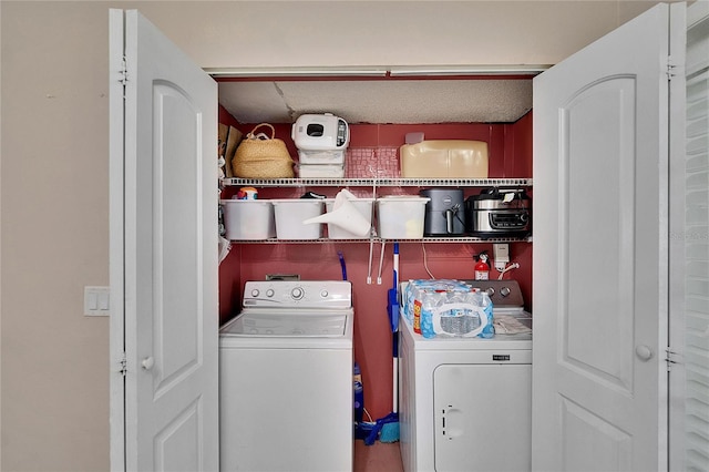 washroom featuring laundry area and washer and dryer