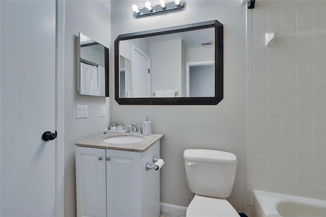 bathroom featuring toilet and vanity