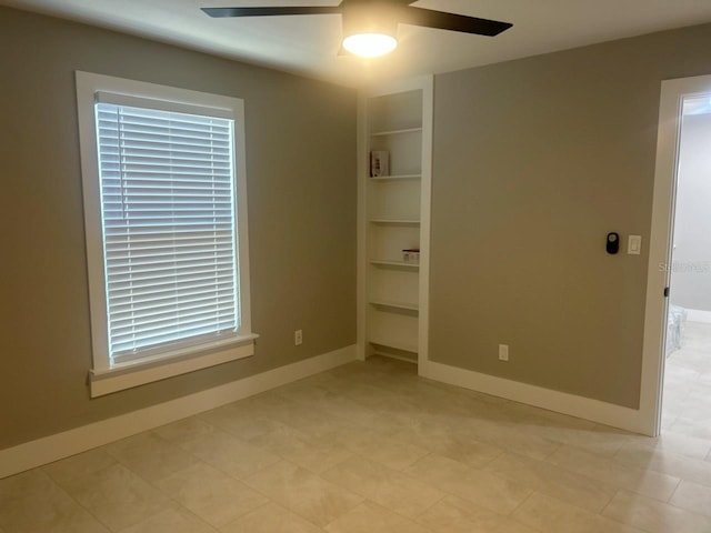 unfurnished bedroom featuring baseboards, a closet, and ceiling fan