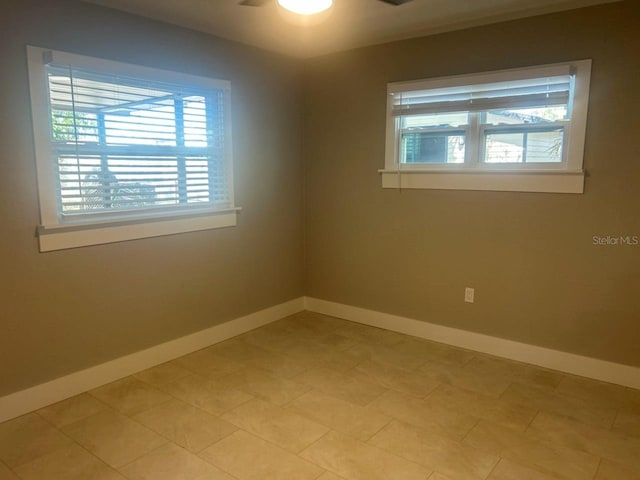 empty room with baseboards