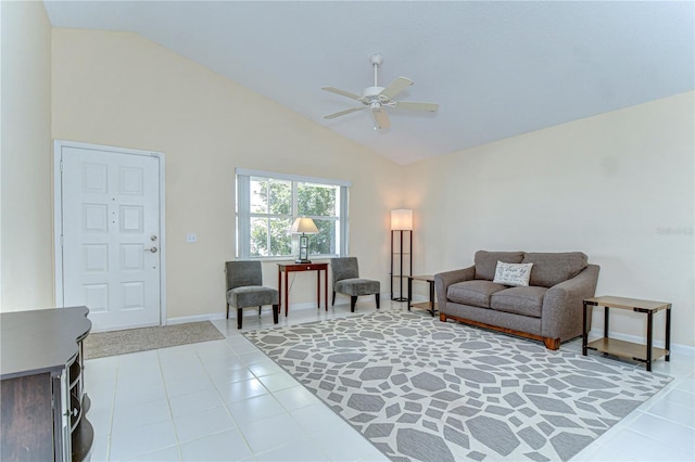 living room with a ceiling fan, light tile patterned flooring, high vaulted ceiling, and baseboards