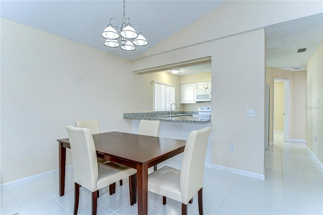 dining area featuring baseboards, visible vents, vaulted ceiling, and a notable chandelier