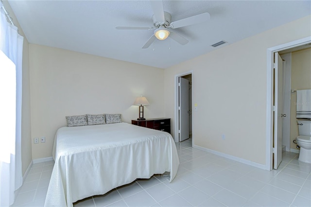 bedroom featuring a ceiling fan, light tile patterned flooring, visible vents, and baseboards