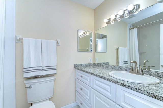 full bathroom with visible vents, vanity, and toilet