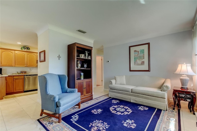 living room with light tile patterned floors and visible vents