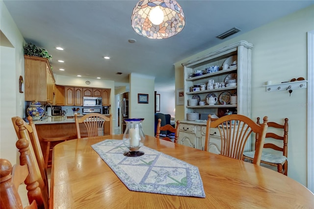 dining area featuring visible vents and recessed lighting