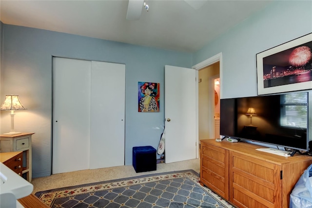 bedroom featuring a ceiling fan and a closet