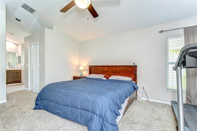 carpeted bedroom featuring lofted ceiling, visible vents, ceiling fan, and baseboards