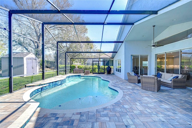 pool with an outbuilding, a lanai, a storage unit, a patio area, and an outdoor living space