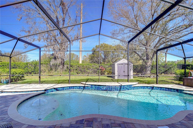 pool with a lanai, a patio area, a storage unit, and an outbuilding