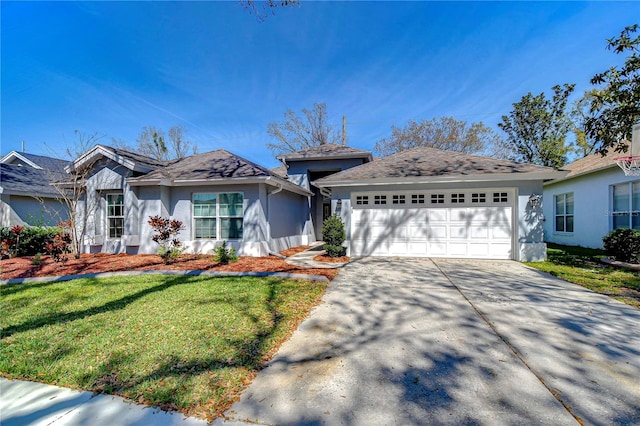 single story home with a front yard, concrete driveway, an attached garage, and stucco siding