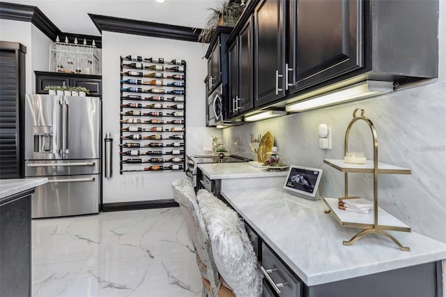 kitchen with marble finish floor, tasteful backsplash, appliances with stainless steel finishes, and crown molding