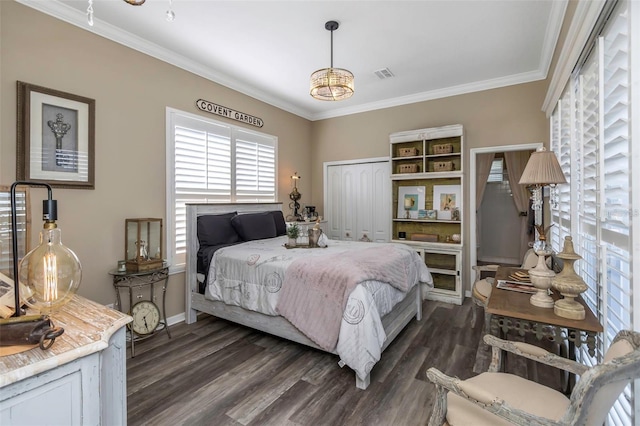 bedroom featuring ornamental molding, visible vents, and dark wood finished floors