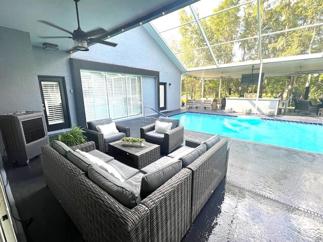 pool featuring a lanai, ceiling fan, an outdoor hangout area, and a patio