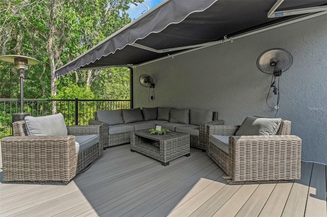 wooden deck featuring an outdoor hangout area