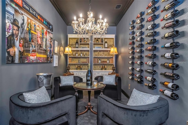 wine room with ornamental molding, carpet, a chandelier, and visible vents