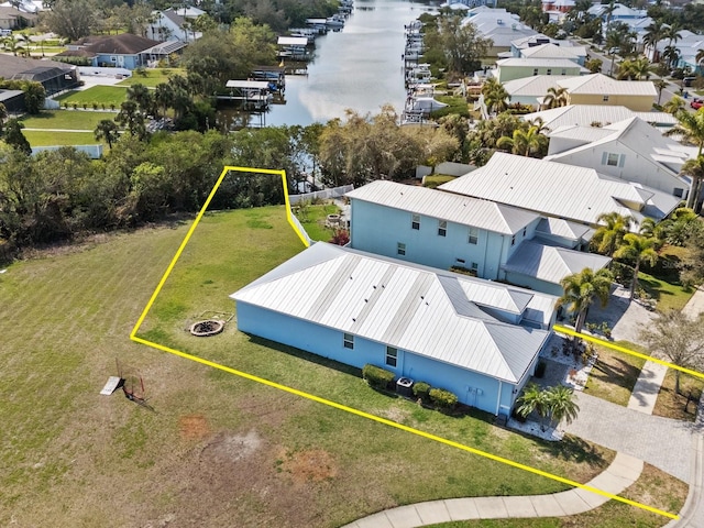 bird's eye view with a water view and a residential view