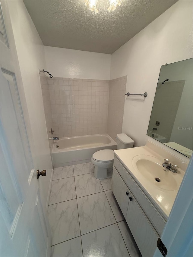 full bath featuring toilet, marble finish floor, shower / bathtub combination, and a textured ceiling