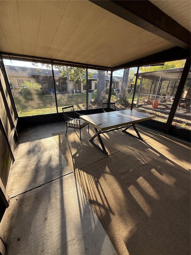 unfurnished sunroom featuring wooden ceiling