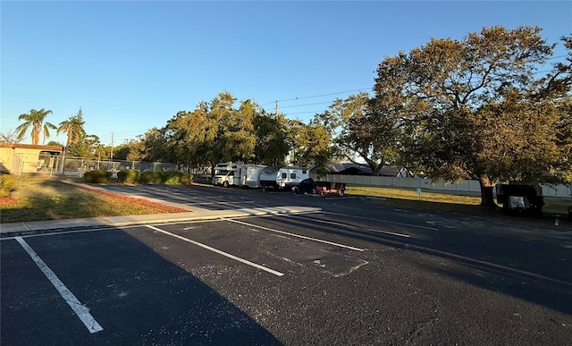 uncovered parking lot with fence