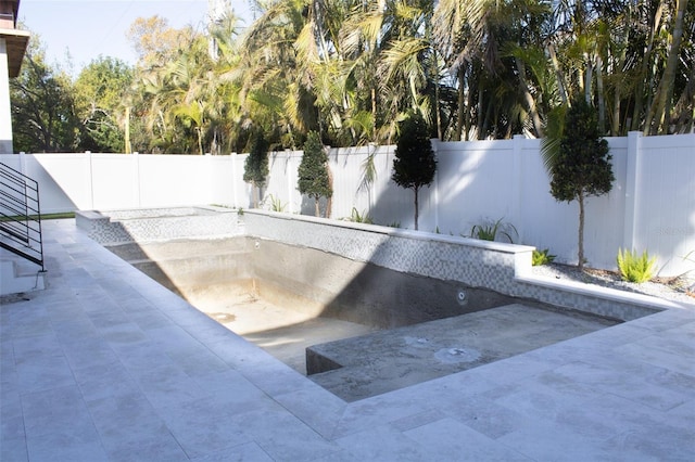 view of pool with a patio area and a fenced backyard