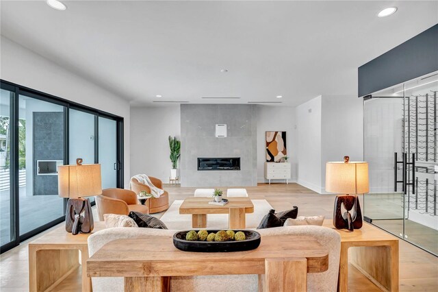 5017 W Dickens Ave, Tampa, FL 33629 - living area with light wood finished floors, recessed lighting, and a fireplace