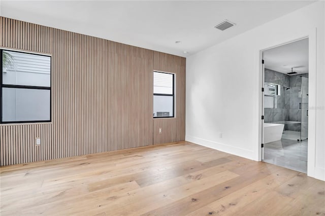 5017 W Dickens Ave, Tampa, FL 33629 - spare room with hardwood / wood-style floors, baseboards, and wood walls