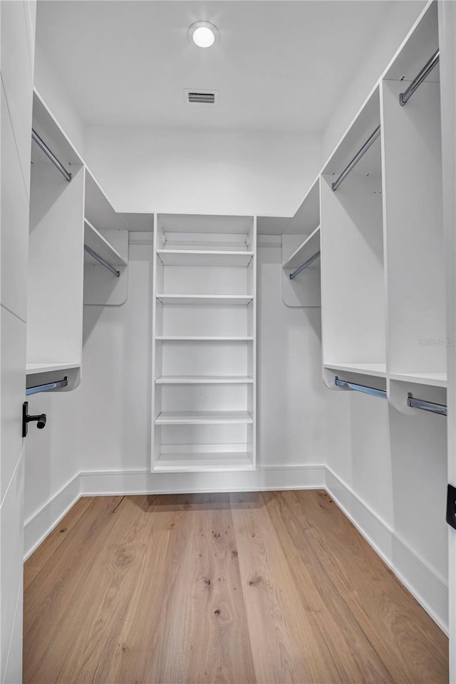 5017 W Dickens Ave, Tampa, FL 33629 - walk in closet with wood finished floors