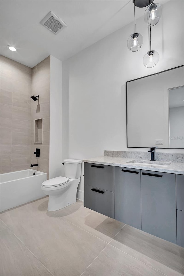 5017 W Dickens Ave, Tampa, FL 33629 - full bath with toilet, vanity, tile patterned floors, and shower / bathtub combination