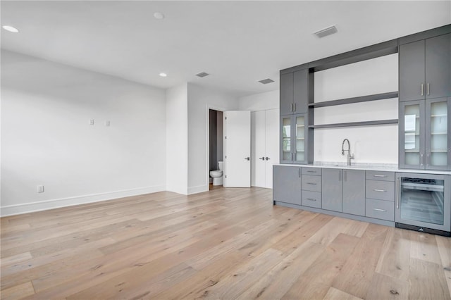 5017 W Dickens Ave, Tampa, FL 33629 - indoor wet bar with beverage cooler, light wood-style floors, baseboards, and recessed lighting