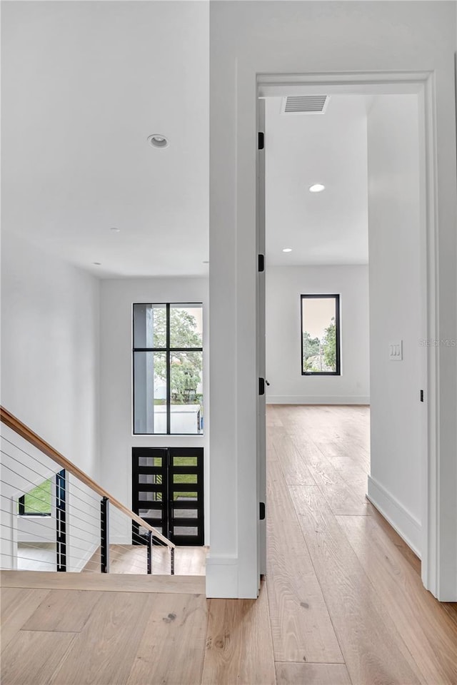 5017 W Dickens Ave, Tampa, FL 33629 - hallway featuring plenty of natural light, wood finished floors, baseboards, and recessed lighting