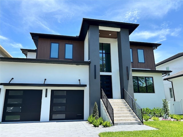5017 W Dickens Ave, Tampa, FL 33629 - view of front of home with stucco siding, decorative driveway, and a garage