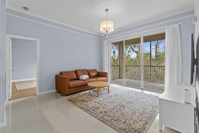 living room with baseboards, ornamental molding, light tile patterned floors, and a notable chandelier