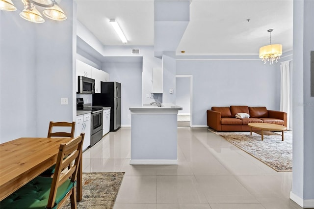 kitchen with visible vents, white cabinets, an inviting chandelier, stainless steel appliances, and light countertops