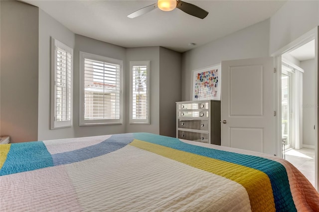 bedroom with tile patterned flooring and a ceiling fan