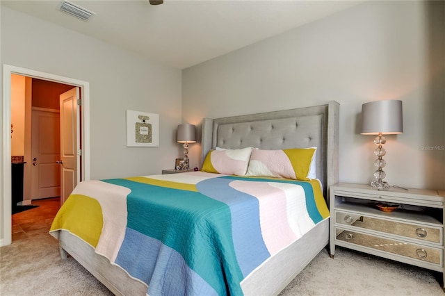 carpeted bedroom with visible vents