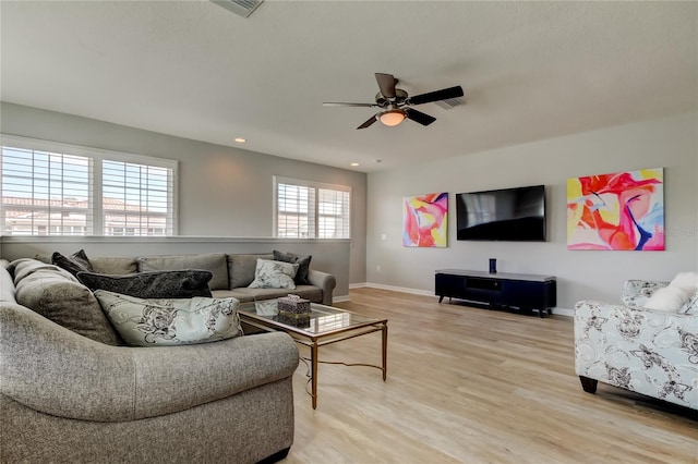 living area with recessed lighting, visible vents, light wood-style flooring, ceiling fan, and baseboards